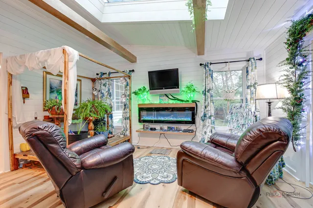 a outdoor living space with furniture and a fireplace