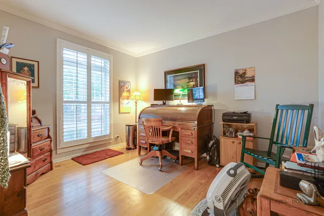 a bedroom with furniture and a window