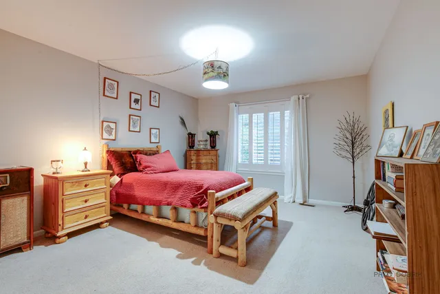 a bedroom with furniture and a chandelier