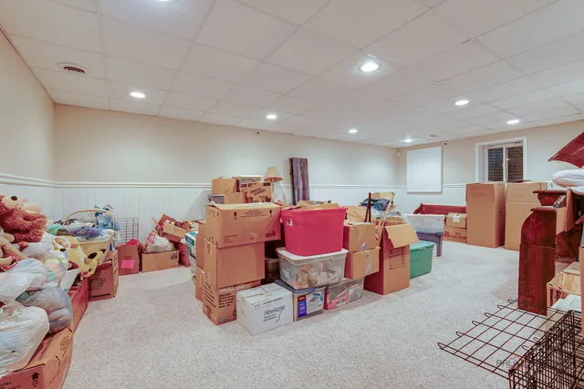 a room with lots of furniture and air hockey table