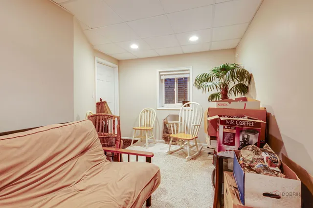 a bedroom with furniture and a window