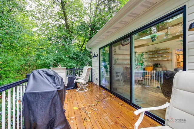 a view of backyard with roof deck and seating space