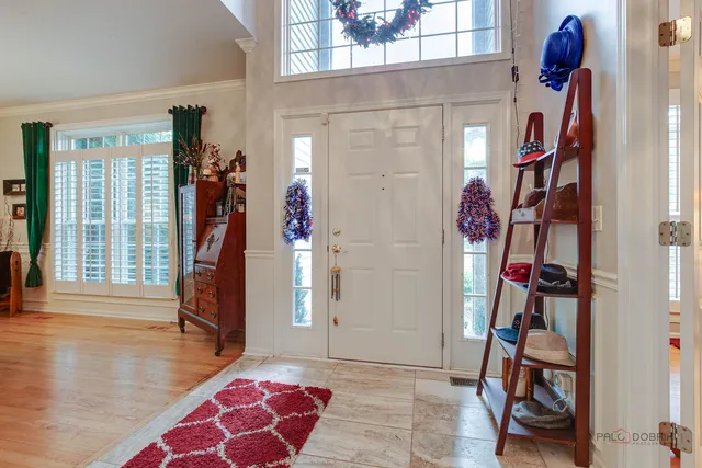a view of an entryway with wooden floor