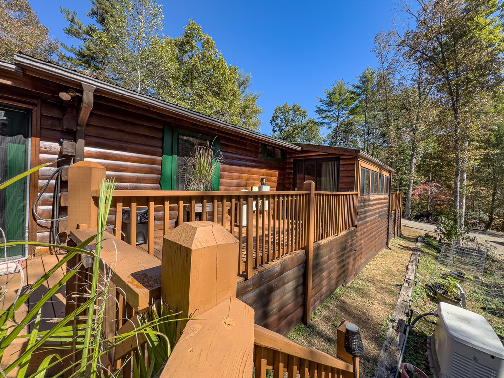 614 Rockridge Road Murphy, NC 28906 - Photo 13 of 43 a view of balcony with wooden floor and fence and a couple of potted plants