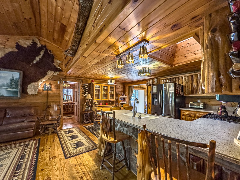 614 Rockridge Road Murphy, NC 28906 - Photo 22 of 43 a view of a patio with table and chairs barbeque with wooden floor and fence