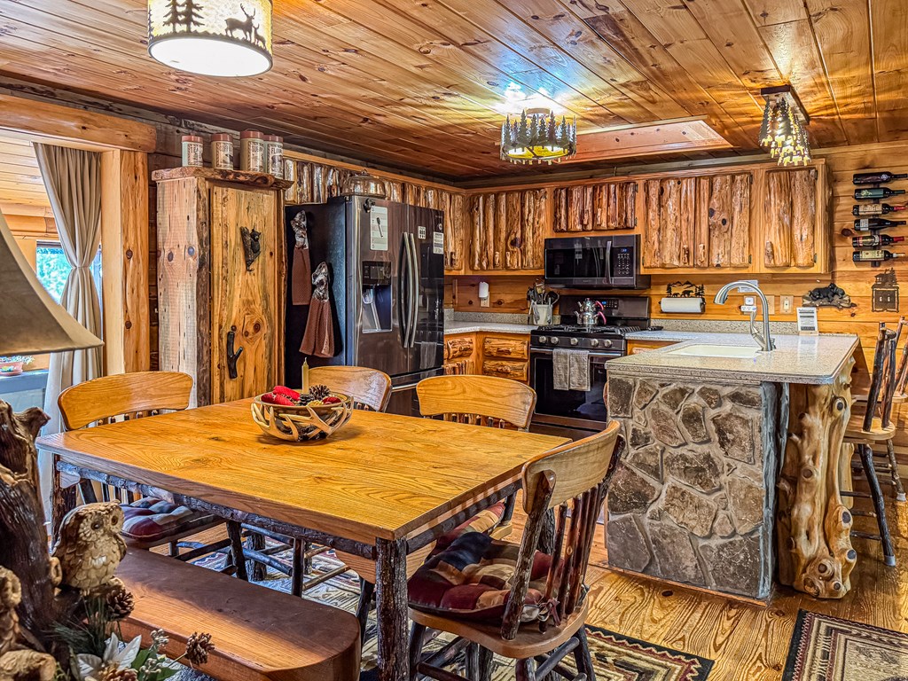 614 Rockridge Road Murphy, NC 28906 - Photo 23 of 43 a dining table with chairs and window