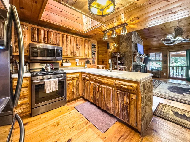 a living room with fireplace furniture and a fireplace