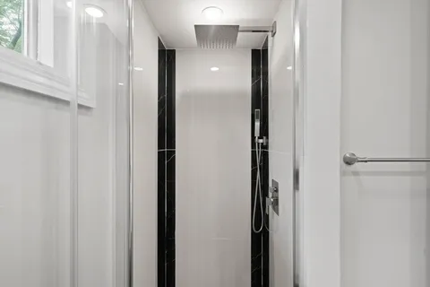 a view of a bathroom from a hallway