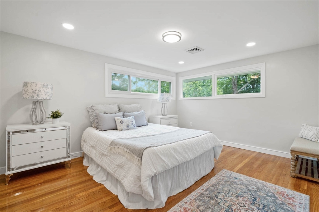 7 Thornberry Road Winchester, MA 01890 - Photo 22 of 35 a bedroom with a bed and a painting on the wall