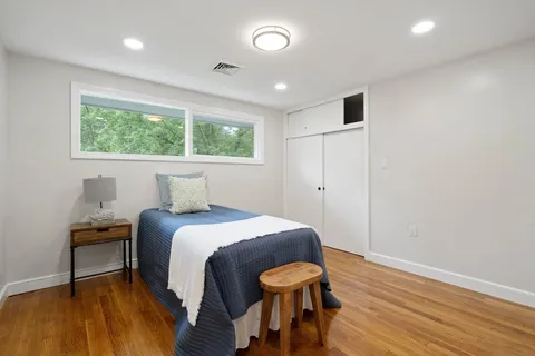 a bedroom with a bed and a table