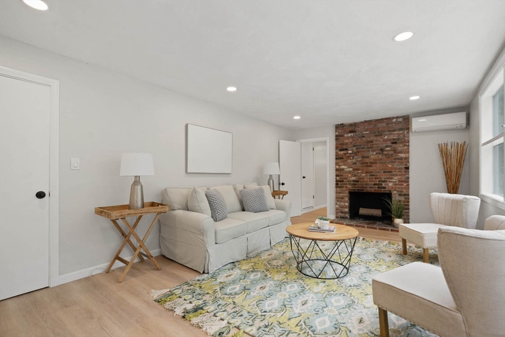 7 Thornberry Road Winchester, MA 01890 - Photo 27 of 35 a living room with furniture and a fireplace