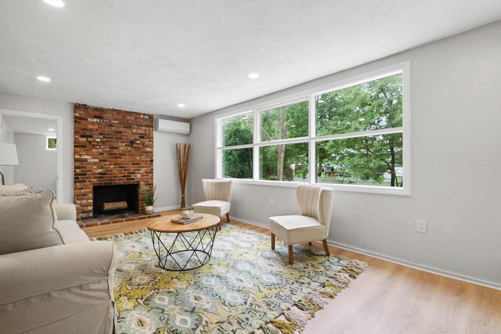 7 Thornberry Road Winchester, MA 01890 - Photo 28 of 35 a living room with fireplace furniture and a large window