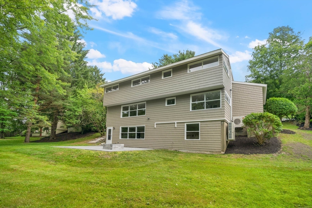 7 Thornberry Road Winchester, MA 01890 - Photo 34 of 35 a front view of a house with garden