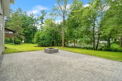 a view of outdoor space with playground and green space