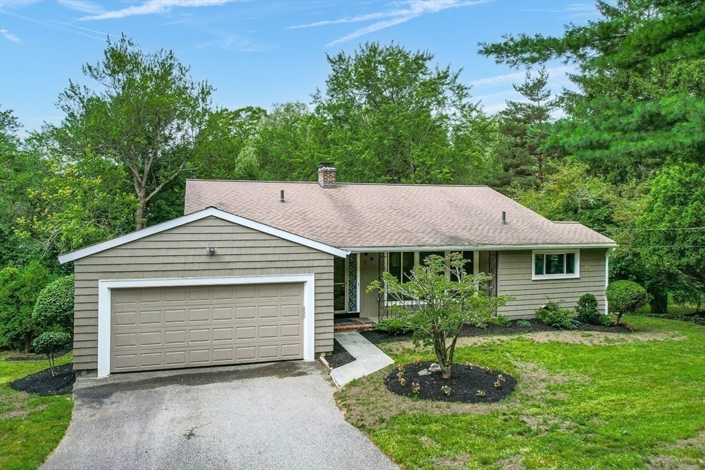 7 Thornberry Road Winchester, MA 01890 - Photo 7 of 35 a front view of a house with a yard
