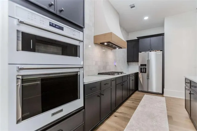 a living room with furniture a fireplace and a table