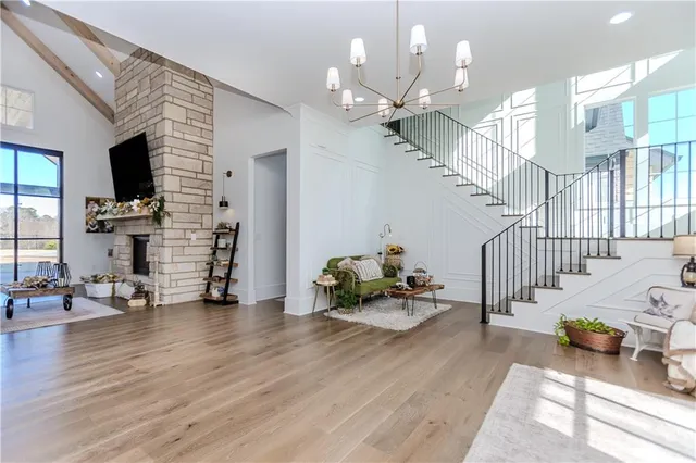 a bedroom with a bed couch and window