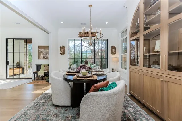 a view of walk in closet with clothes
