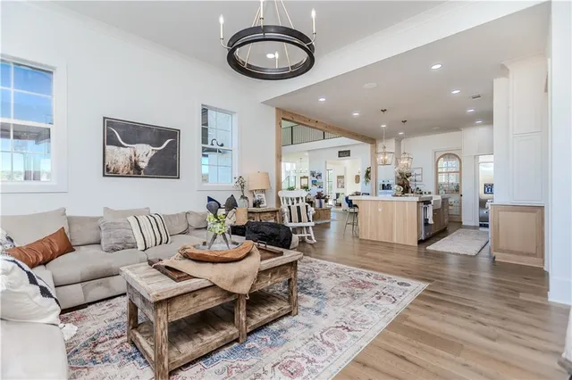 a kitchen with cabinets stainless steel appliances a sink and a window