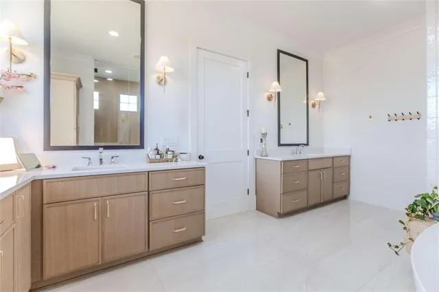 a bedroom with a bed and flat screen tv