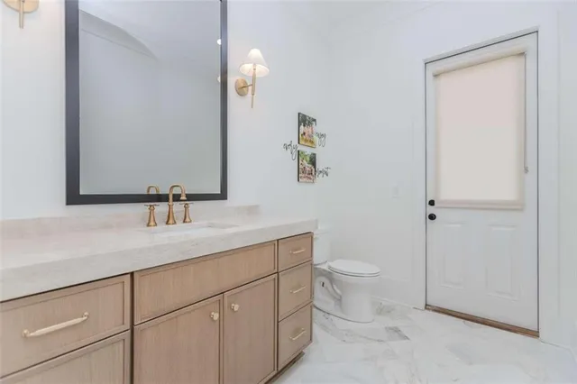 a bedroom with a bed and a desk