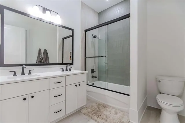 a living room with patio furniture and a floor to ceiling window
