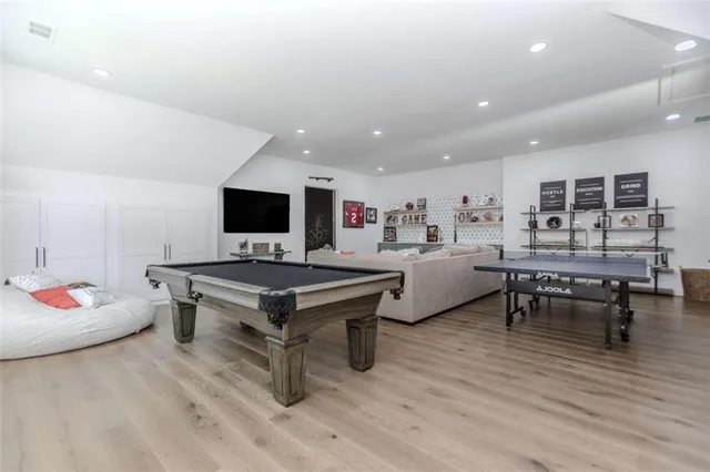 a view of a house with pool and a yard