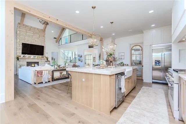a kitchen with stainless steel appliances wooden cabinets and stove
