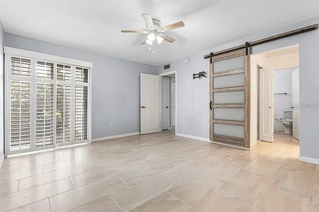a view of an empty room with a window