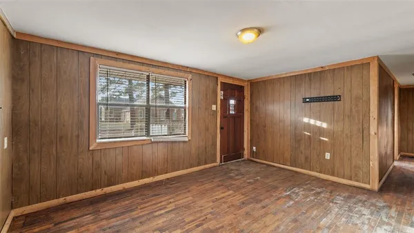 a kitchen with granite countertop a sink stove and cabinets
