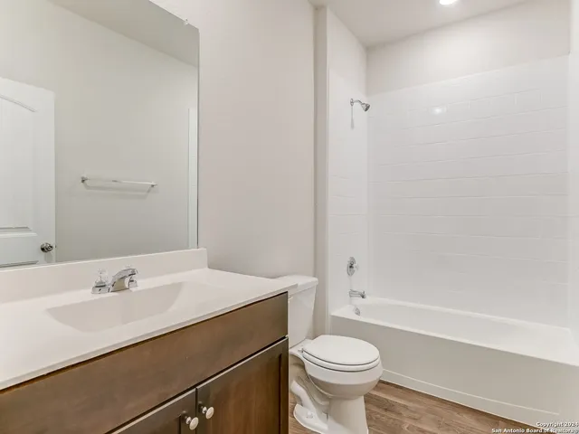 a bathroom with a sink a toilet and a bathtub