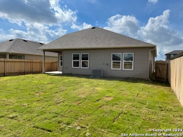 a house with yard in front of it
