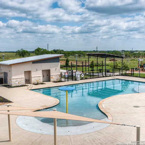 a view of a swimming pool with a patio