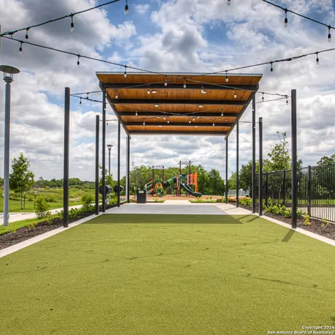 a view of a pathway with a back yard