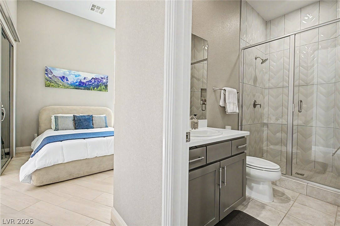 6014 Willow Ridge Court Las Vegas, NV 89135 - Photo 51 of 99 This private sanctuary features a comfortable bedroom and an adjoining full bathroom with a walk-in shower.
