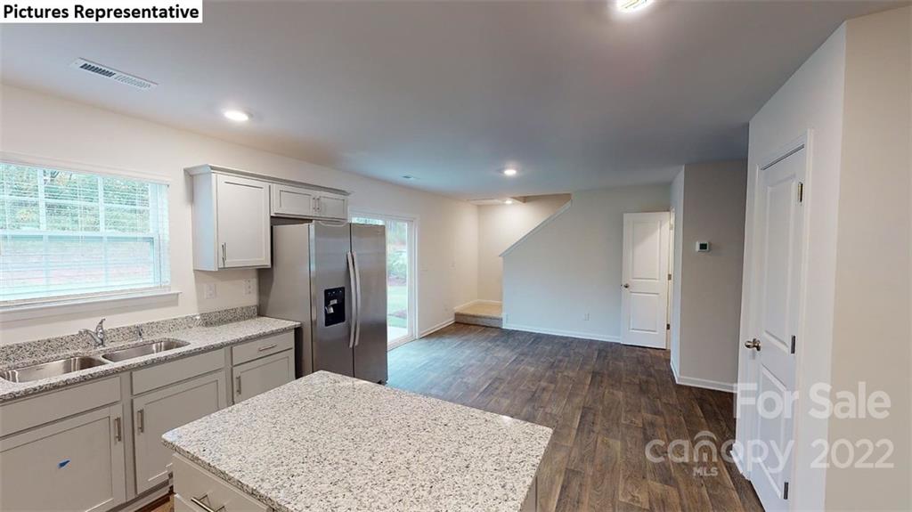 5022 Fandango Road York, SC 29745 - Photo 5 of 18 a kitchen with a sink a refrigerator and cabinets