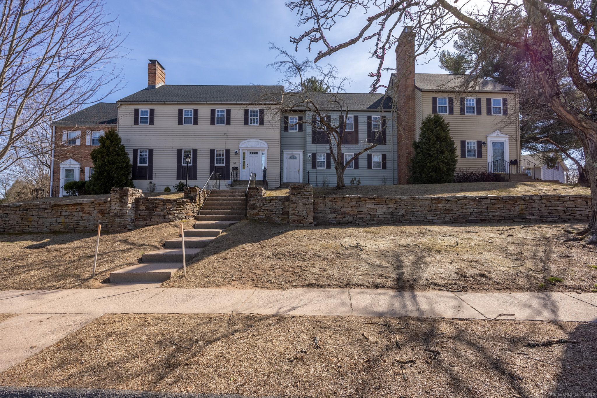 38 Willieb Street, Unit 38 Glastonbury, CT 06033 - Photo 1 of 20 a front view of a house with garden