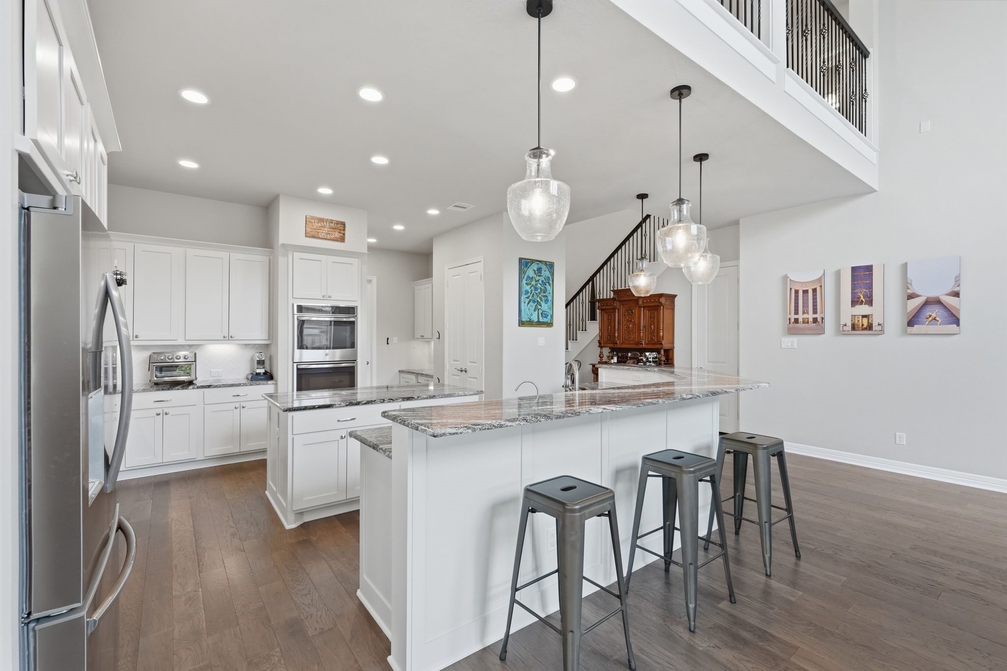 27705 South Slate Hills Lane Spring, TX 77386 - Photo 11 of 45 Large raised breakfast bar can seat up to 6 barstools.