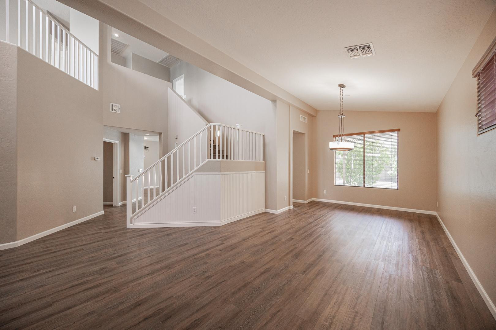 6539 West Jomax Road Phoenix, AZ 85083 - Photo 11 of 39 wooden floor in an empty room with a window