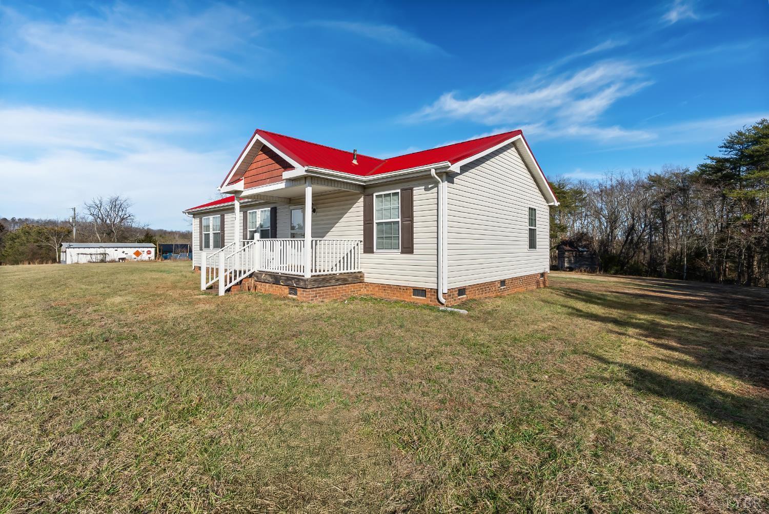 309 Marion Road Chatham, VA 24531 - Photo 9 of 27 a view of a house with a backyard