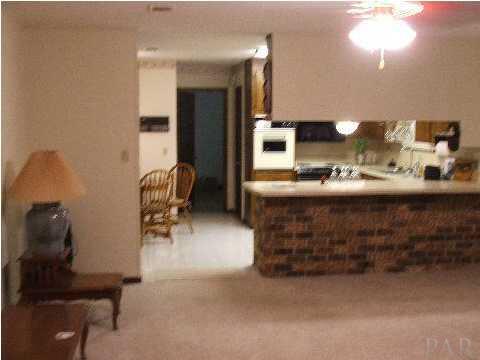 4839 Williams Road Pace, FL 32571 - Photo 14 of 17 GREAT ROOM TO KITCHEN ~ BREAKFAST BAR & EAT N KITCHEN