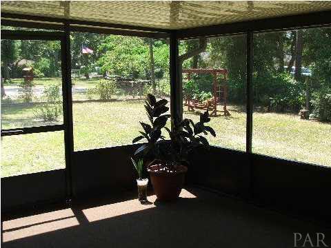 4839 Williams Road Pace, FL 32571 - Photo 5 of 17 ~ SCREENED PATIO ~ 2005 ~ NEW CARPET ~ 14 x 18 ~ ENJOY GREAT SOUTHERN LIVING ~