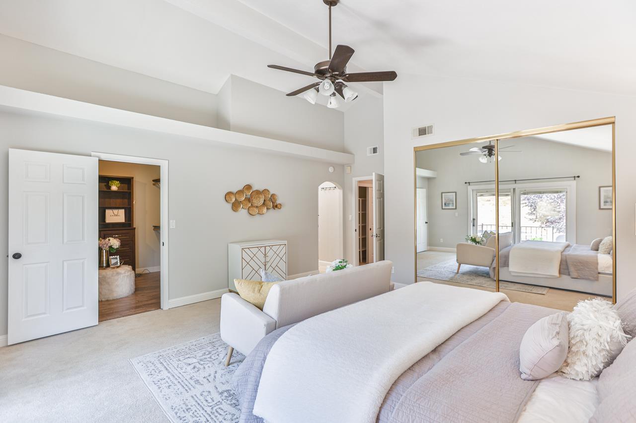 220 Rio Grande Court San Ramon, CA 94582 - Photo 19 of 33 a bedroom with a bed and a chandelier