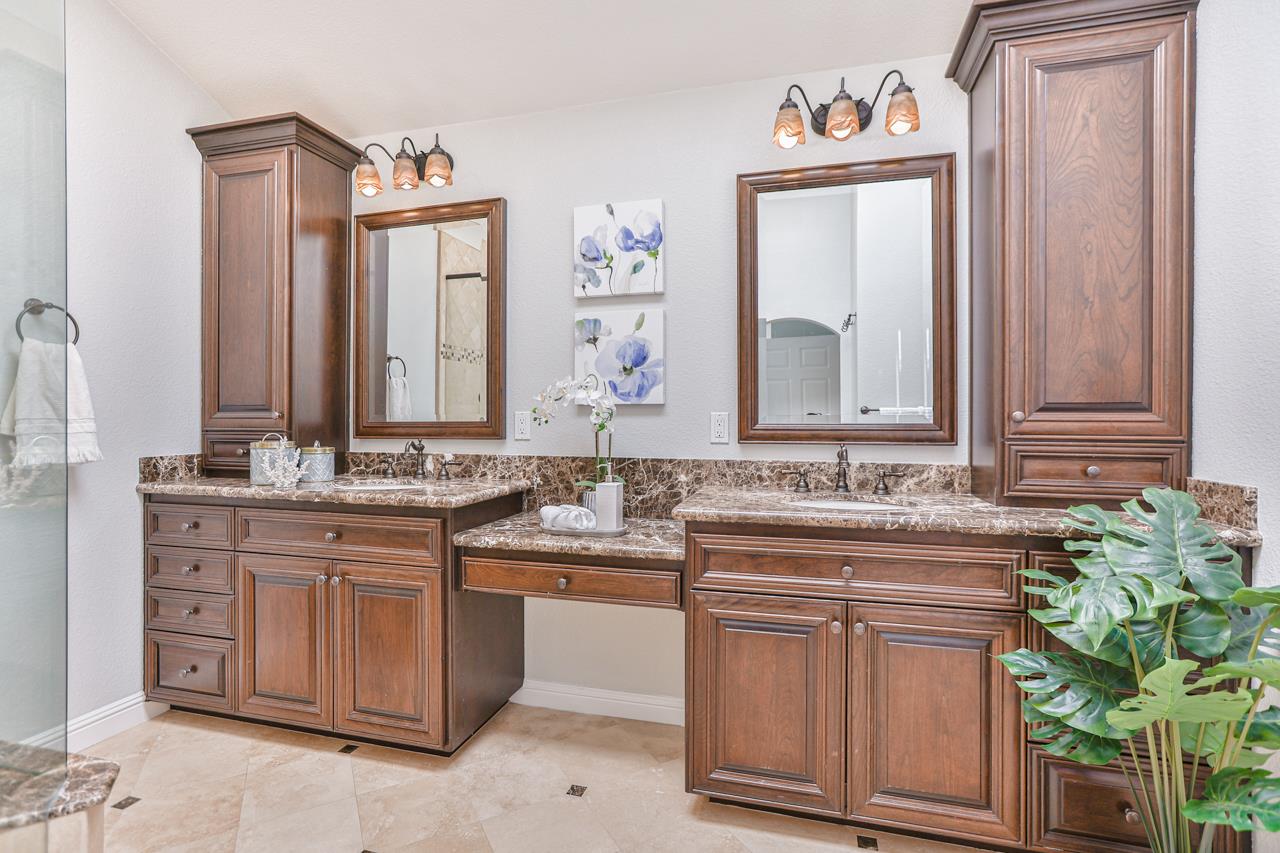 220 Rio Grande Court San Ramon, CA 94582 - Photo 22 of 33 a bathroom with a granite countertop sink and a mirror