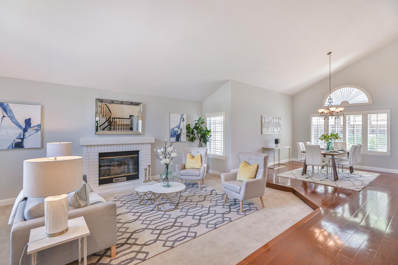 220 Rio Grande Court San Ramon, CA 94582 - Photo 6 of 33 a living room with furniture a fireplace and a chandelier