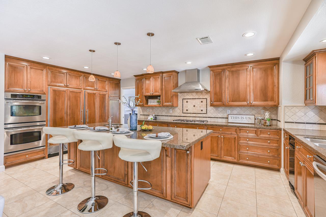 220 Rio Grande Court San Ramon, CA 94582 - Photo 10 of 33 a kitchen with stainless steel appliances granite countertop a stove top oven a sink dishwasher and cabinets with wooden floor