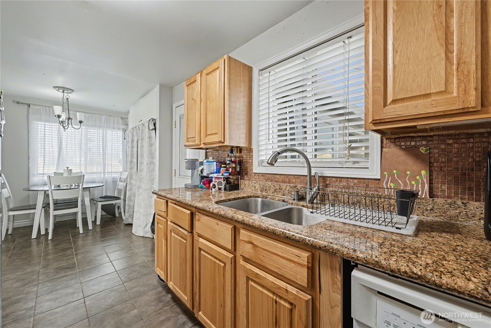 160 G Street Northeast Ephrata, WA 98823 - Photo 13 of 34 a kitchen with kitchen island granite countertop a sink and counter space