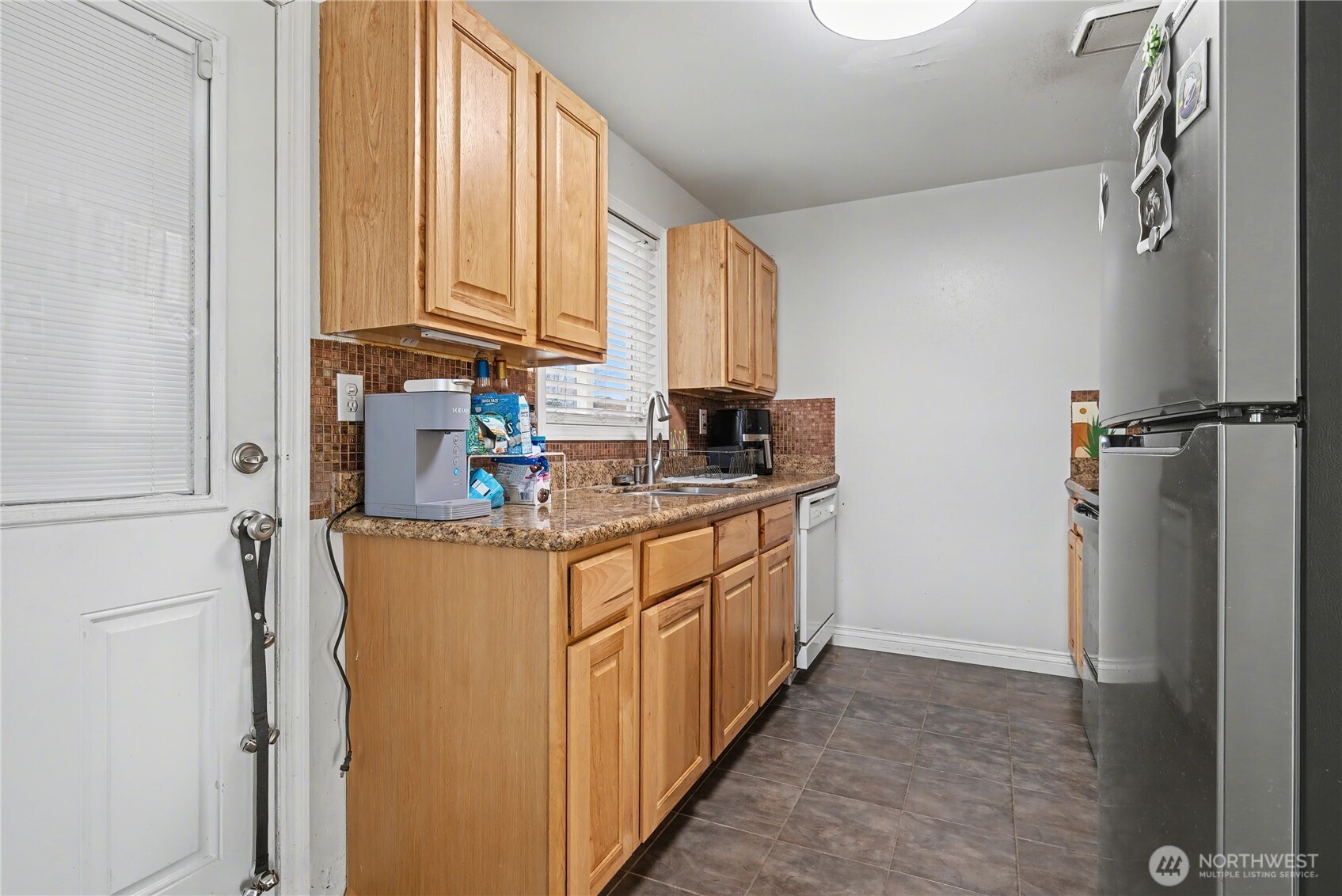 160 G Street Northeast Ephrata, WA 98823 - Photo 14 of 34 a kitchen with stainless steel appliances granite countertop a refrigerator a stove and a sink