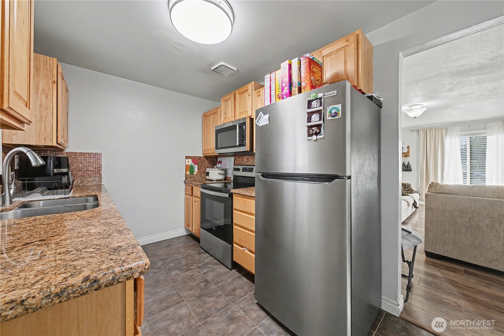 160 G Street Northeast Ephrata, WA 98823 - Photo 15 of 34 a kitchen with stainless steel appliances granite countertop a refrigerator and a sink