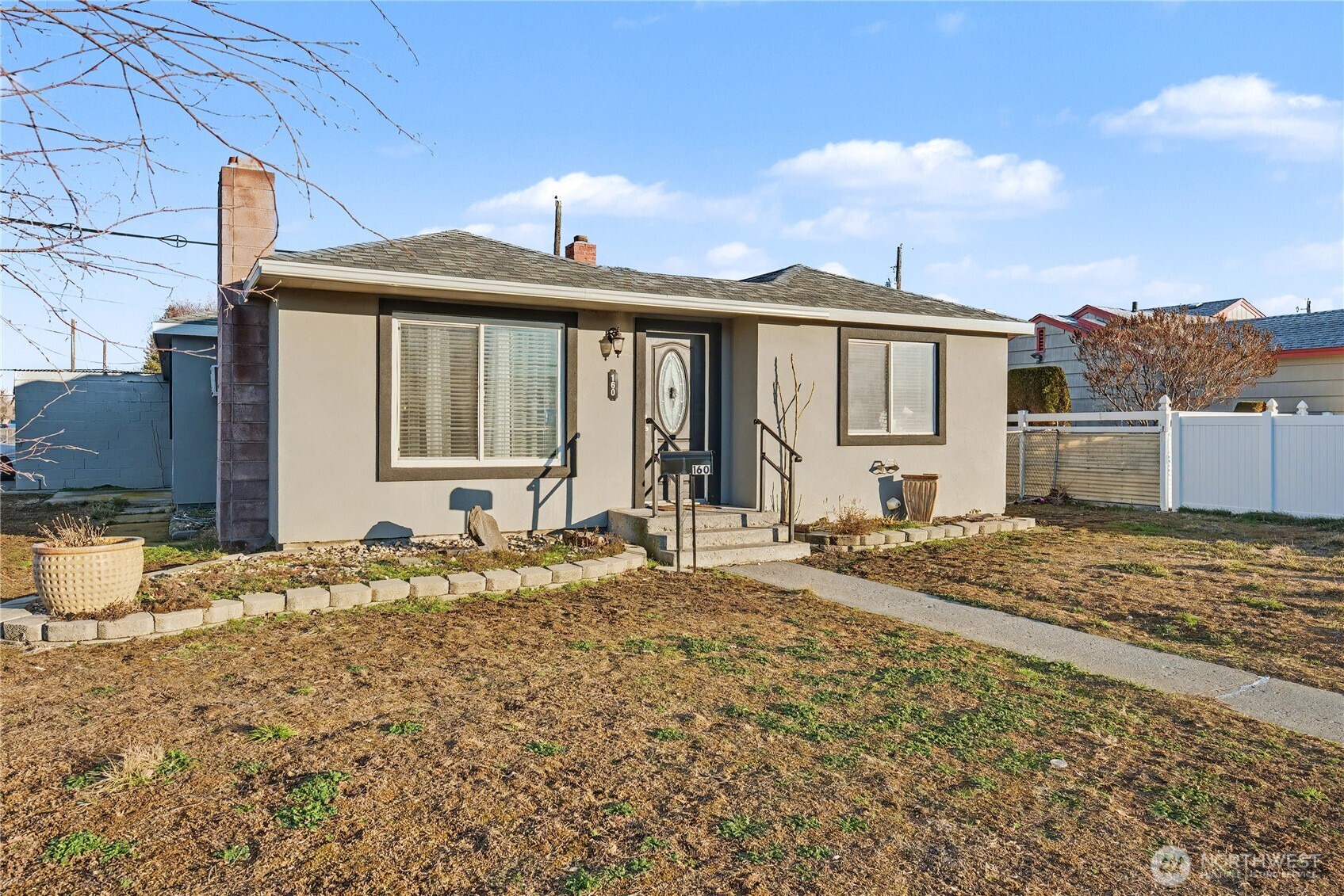 160 G Street Northeast Ephrata, WA 98823 - Photo 2 of 34 a front view of a house with a yard